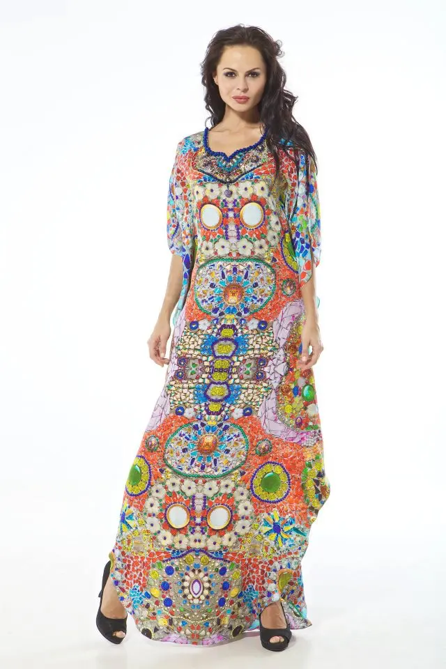 Model wearing a full-length classic kaftan in pebble and tile print with a hand-embroidered Swarovski sweetheart neckline.